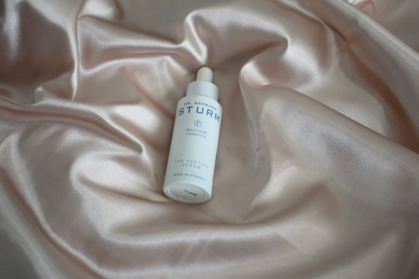 Dr. Barbara Sturms The Peptide Serum displayed on a silk sheet